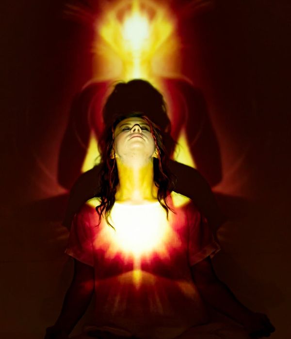 Woman in a flowing yoga pose with periwinkle color accents.